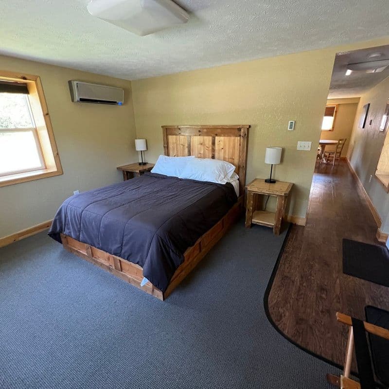 Queen Suite bedroom with a made queen bed