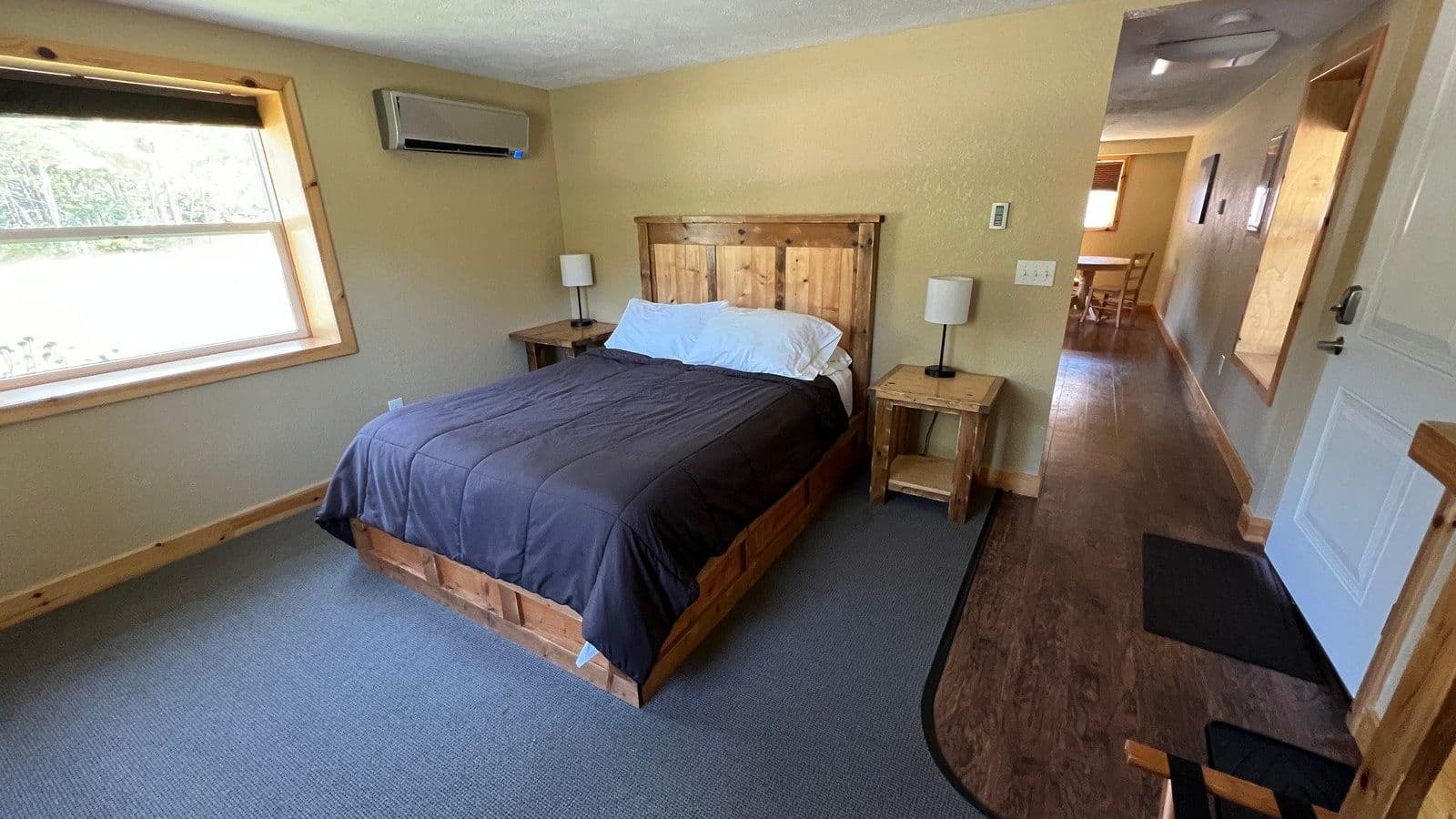Queen Suite bedroom with a made queen bed