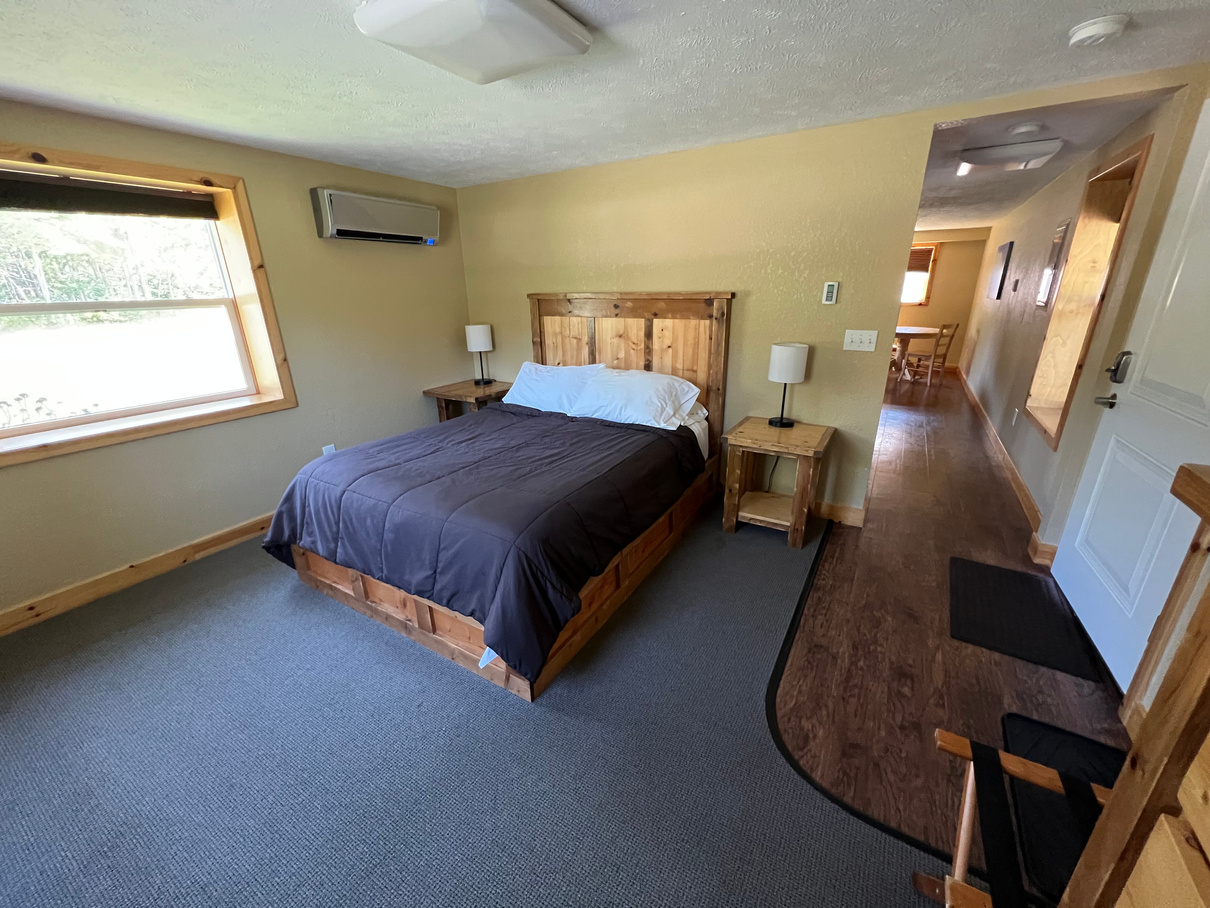 Queen bed hotel suite paradise Michigan Tahquamenon suites