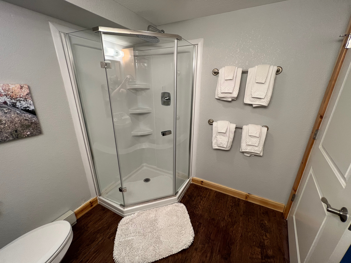King family hotel suite paradise Michigan Tahquamenon suites lodging Bathroom with glass shower